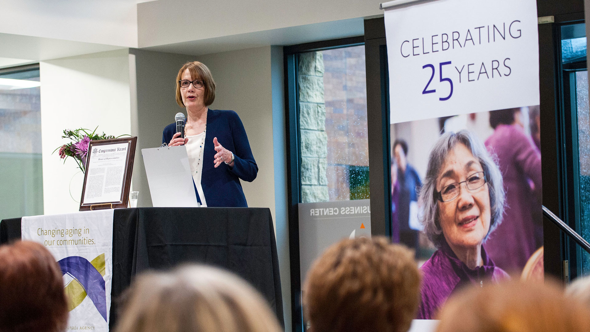 Photo of Dawn Simonson speaking at a podium.