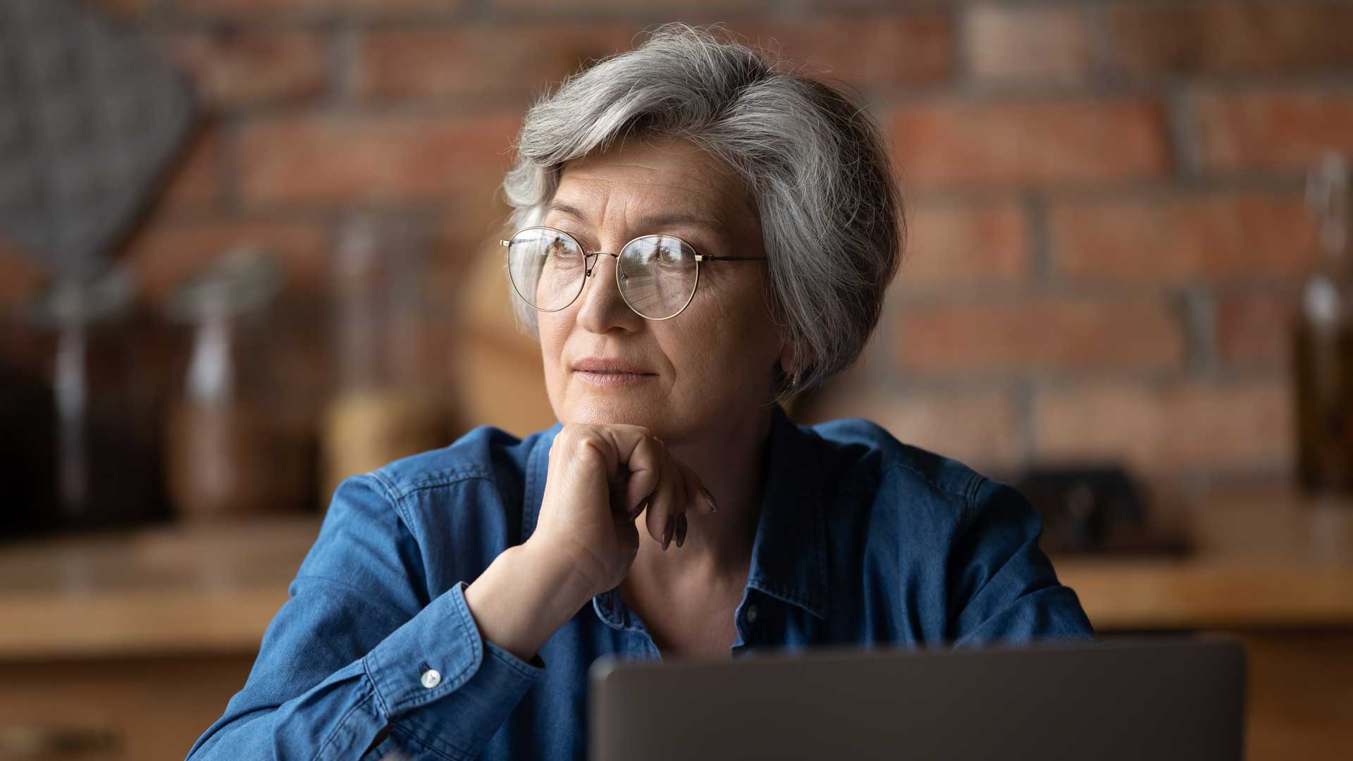 Photo of an older person looking to the left.