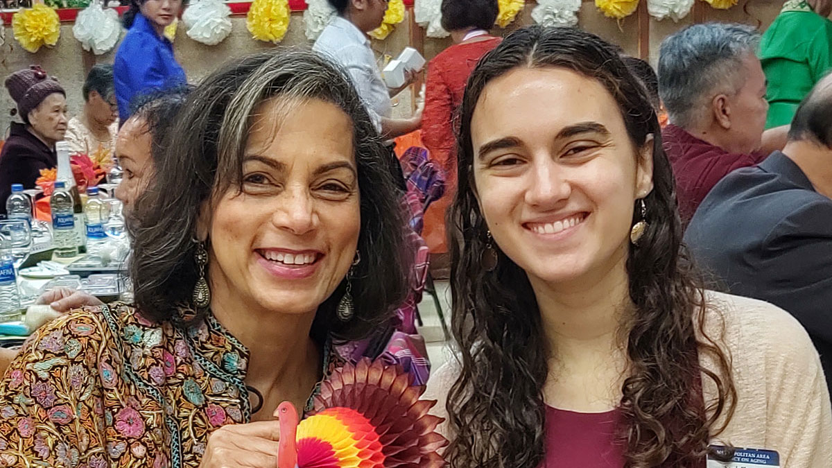Two people smiling.