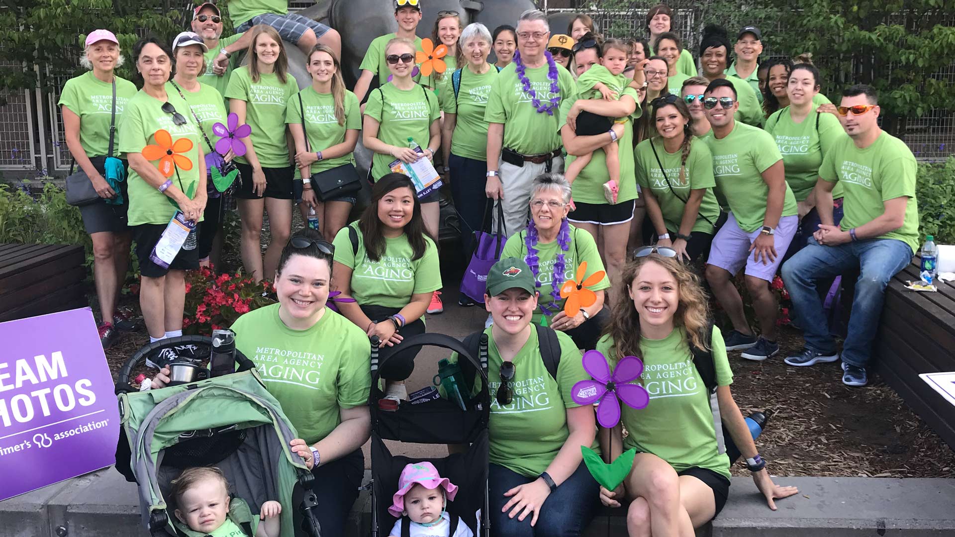 Photo of a large group of people wearing matching t-shirts.