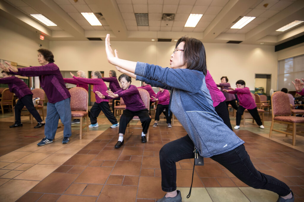 Photo of a group of people exercising.