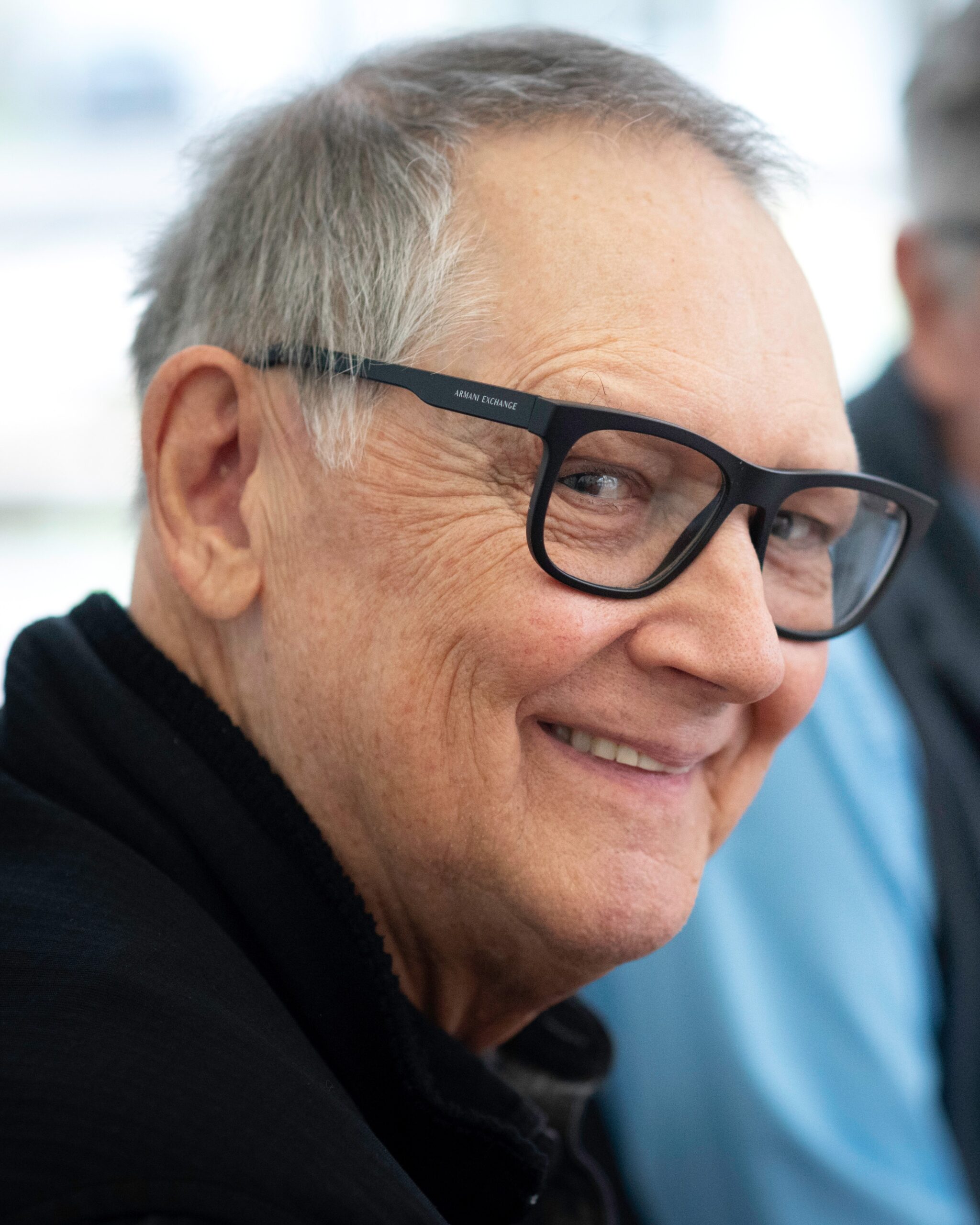 Photo of an older man smiling.